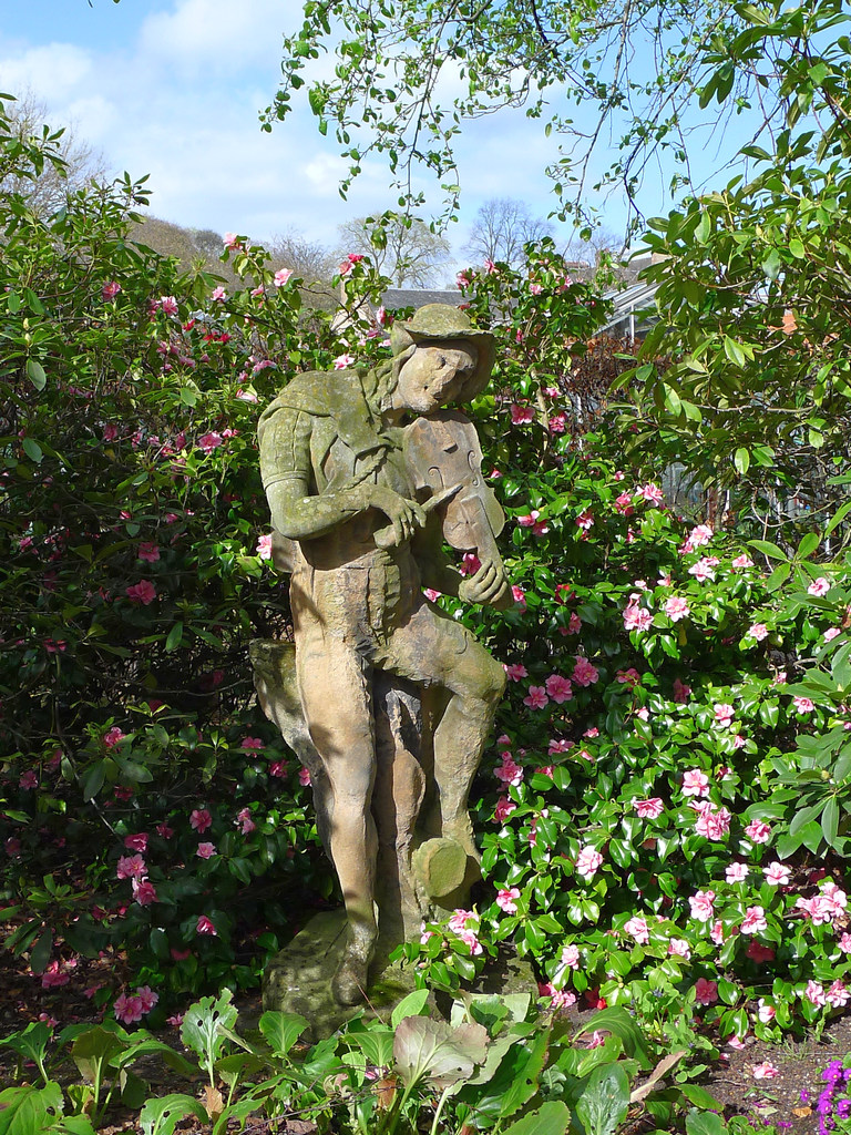 Holyrood_R0009a.JPG - I like this statue of a medieval fiddler. It's April and the flowers are starting to bloom.