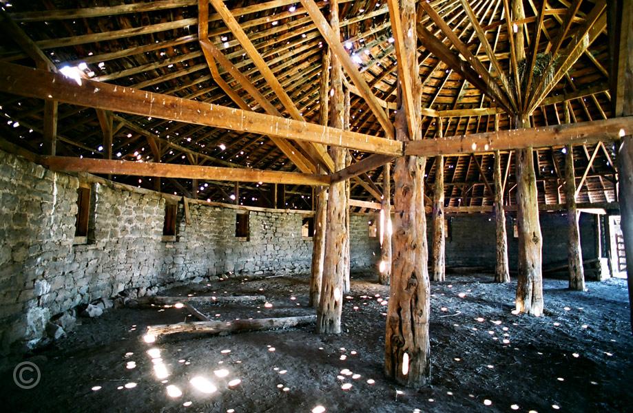 J-barn006.jpg - Interior detail of the Peter French round barn near Diamond, OR. Center posts are juniper. The barn was used to break horses during the winter months. Peter French owned most of the rangeland in the vicinity. He was shot by a settler in 1897.